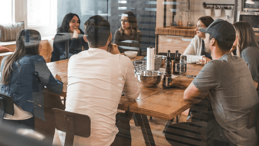 team sitting around a table chatting