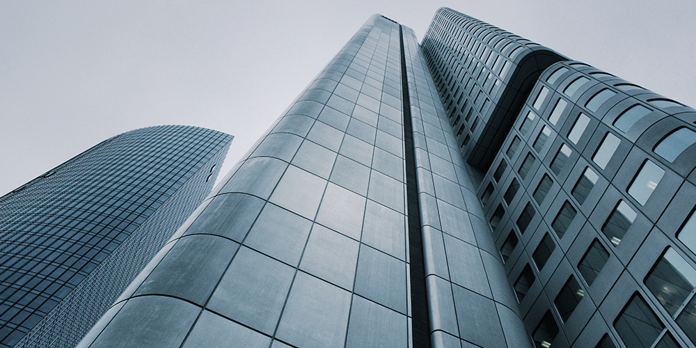 Looking up at a building in a city environment.