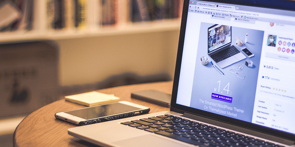 Website's marketing and growth on a laptop open to website in progress.