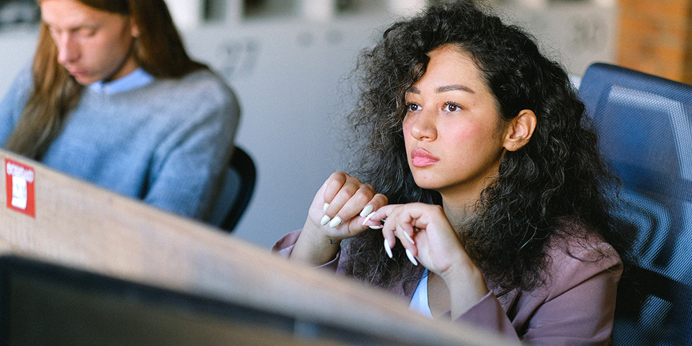 Woman thinking representing mental toughness.