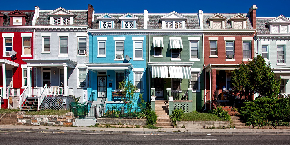 A neighborhood with close-together houses, with different livability factors.