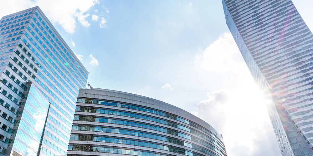 Tall glass windowed office buildings, a part of commercial real estate