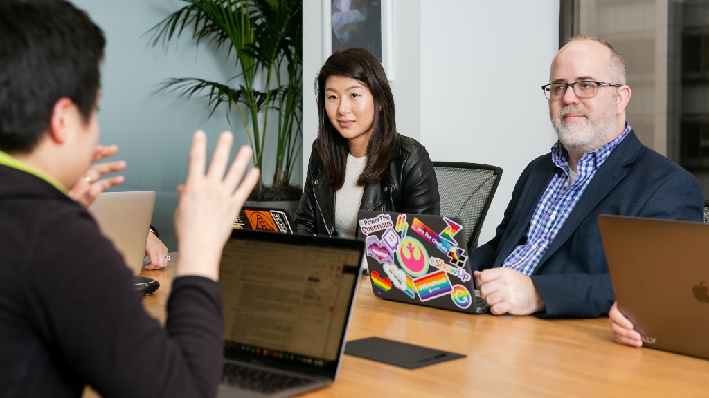 Person asking question in meeting representing internal communication