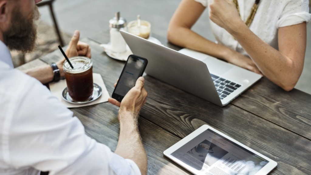Man holding phone representing digital declutter
