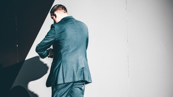 person looking at watch representing failed transactions