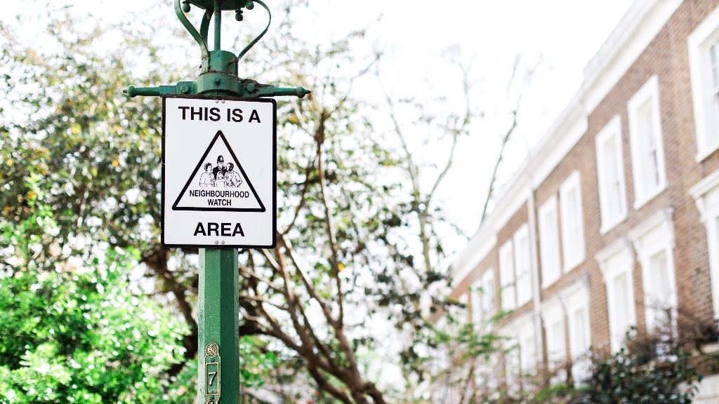 neighborhood watch sign representing realtor danger, safety, and avoiding being a target