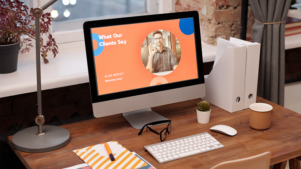 A mac computer open to an advertising page showing client testimony page for a orange-themed company.