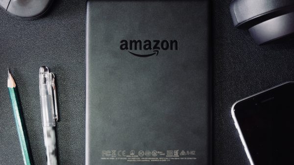 Mouse, headphones, phone, pen, pencil, and Amazon tablet