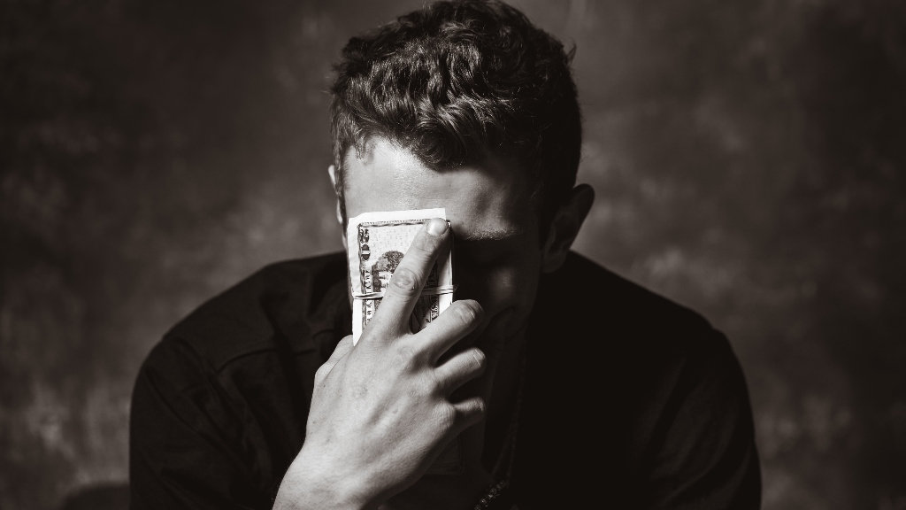 Person holding money representing increasing inflation