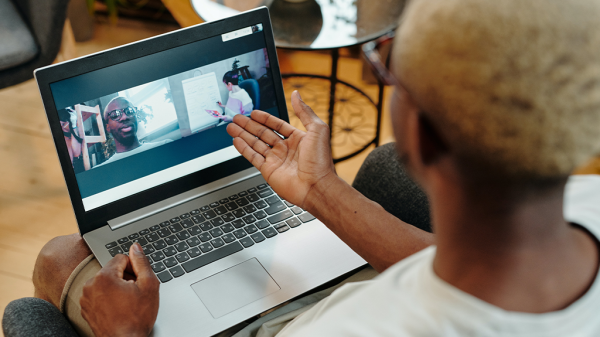 A person in a Zoom meeting with two others, where a Zoom timer could have been used.