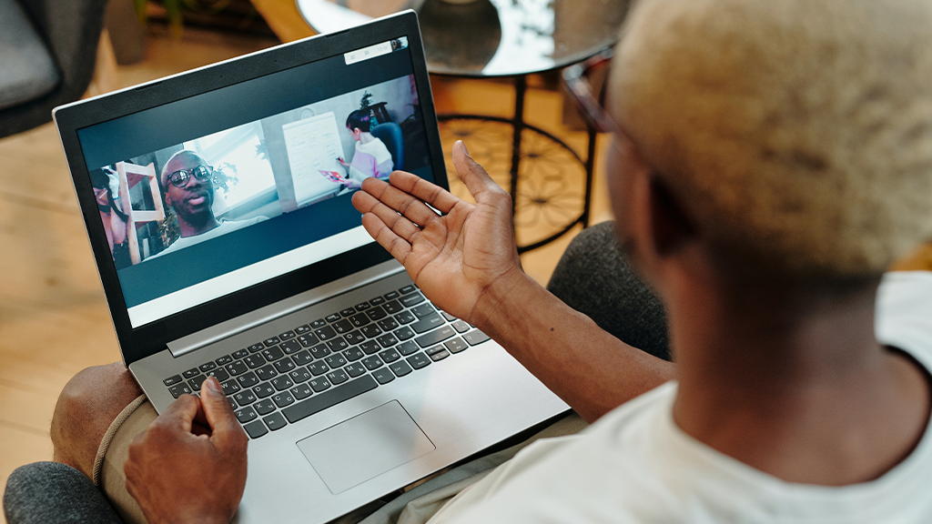 A person in a Zoom meeting with two others, where a Zoom timer could have been used.