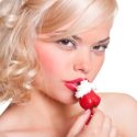 portrait of sexy blonde with strawberry