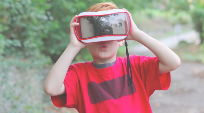 Kid using VR googles representing parenting in a digital world.