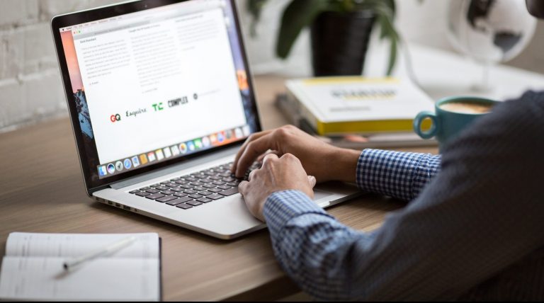 Man working on laptop representing time well-spent.