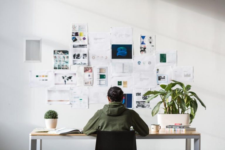 Freelance male sitting at his desk.