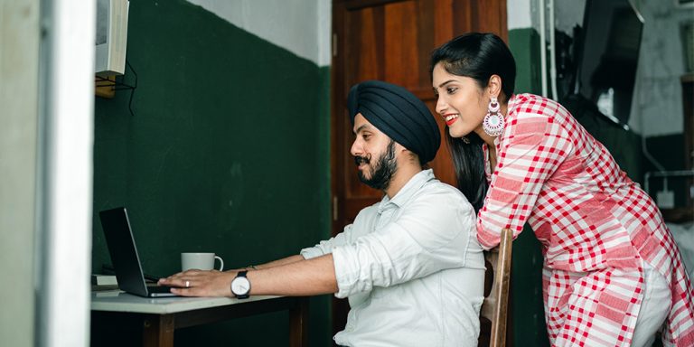 Young couple working on startup together.