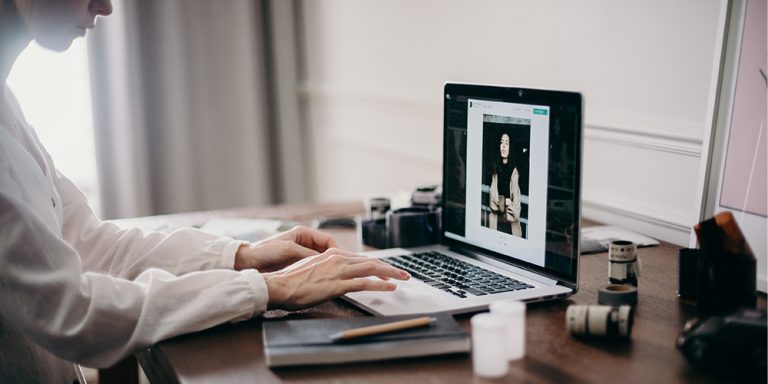 UX design being created by a designer on a laptop.
