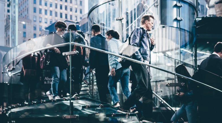 People walking at work representing the tech industry