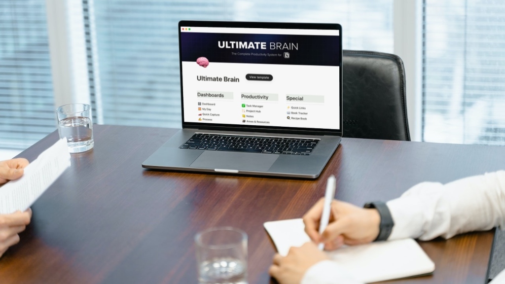 Ultimate Brain for Notion dashboard on laptop in meeting Ultimate Brain for Notion dashboard on laptop in meeting