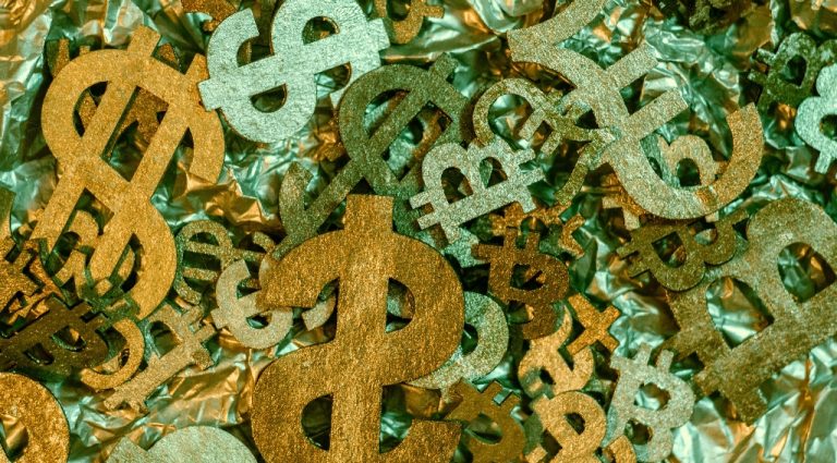 money, bitcoin, and ethereum signs representing crypto