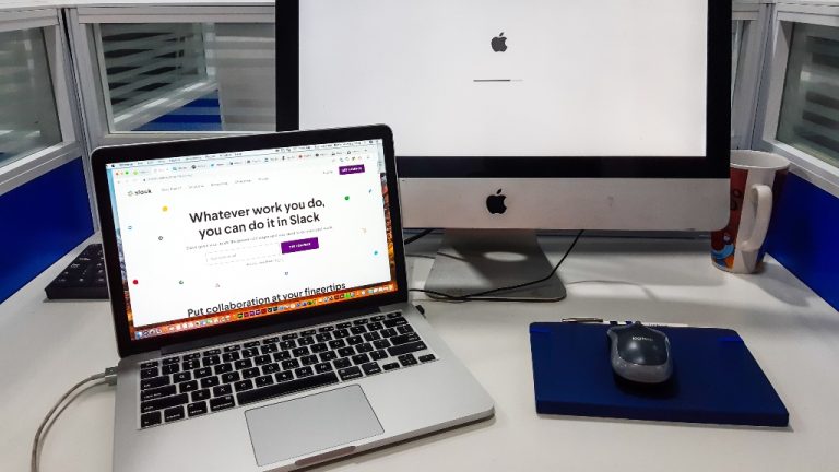 slack on laptop in office
