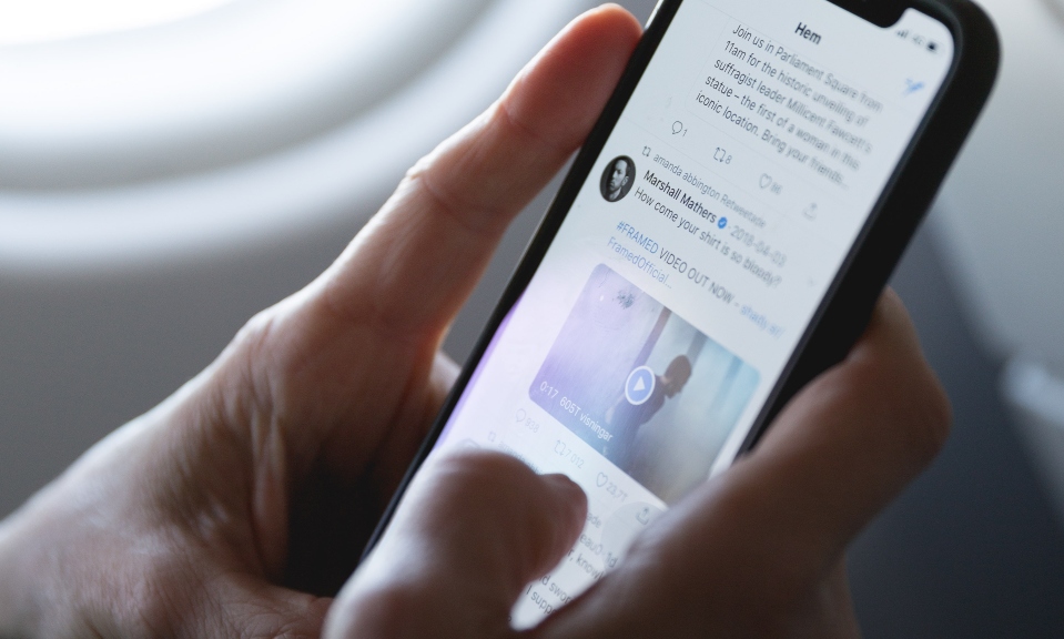 twitter on phone twitter, owned by elon musk, on phone showing blue verification checkmark