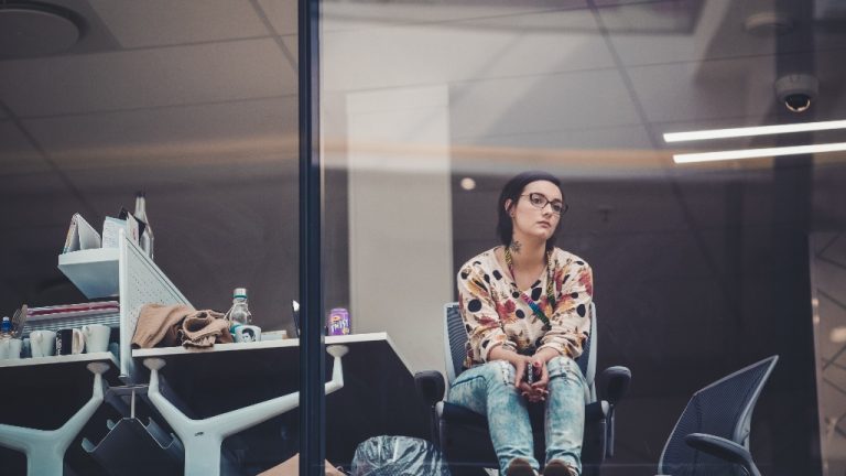 Person looking at window from office representing salesforce layoffs