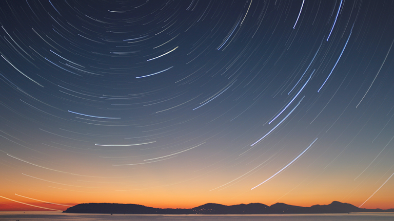 A sunset sky looking at stars in space, swirling above where a space bank could be.